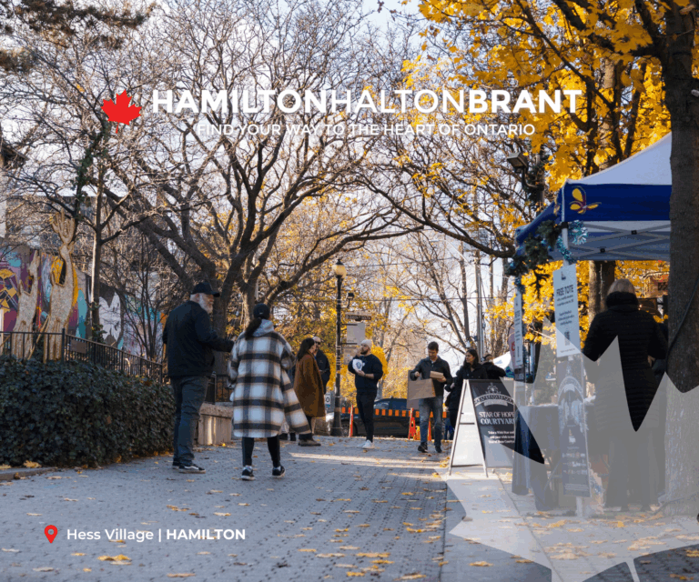 October 2025 E-blast Header showing people walking along Hess Village