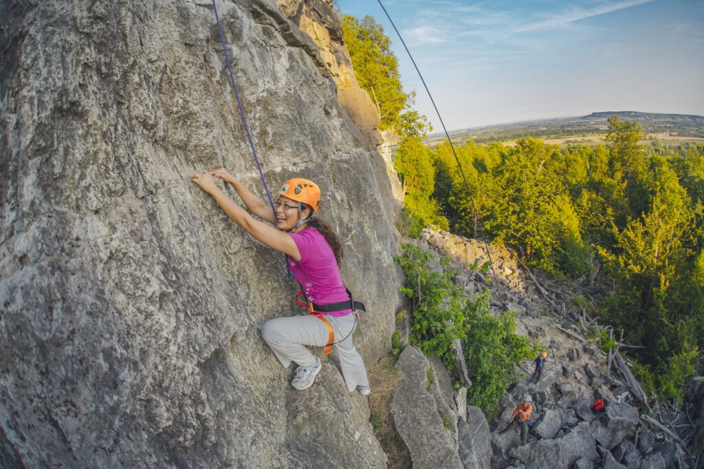 woman rock climbing at Rattlesnake Point Conservation Area